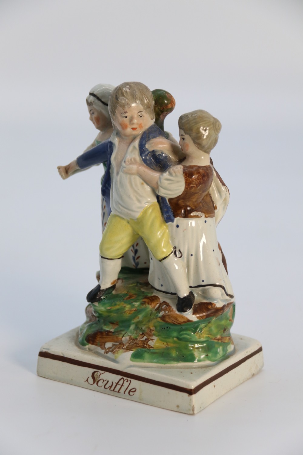 A rare pair of late 18th century English Staffordshire figure groups of two young men about to have a scuffle. View XVI