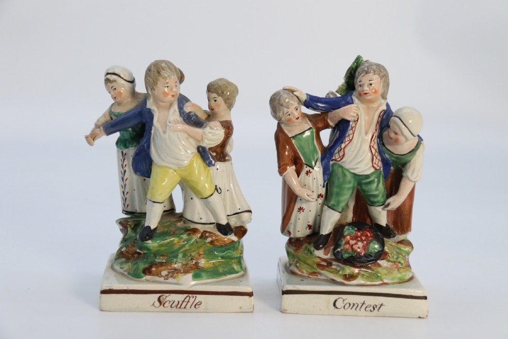 A rare pair of late 18th century English Staffordshire figure groups of two young men about to have a scuffle. View XXIV