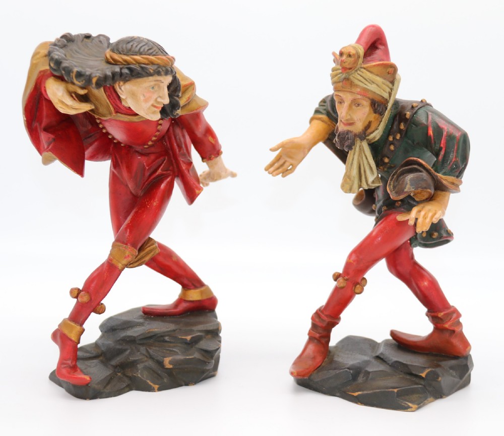 A superb pair of Black Forest carved lime wood and polychrome painted dancing jester figures