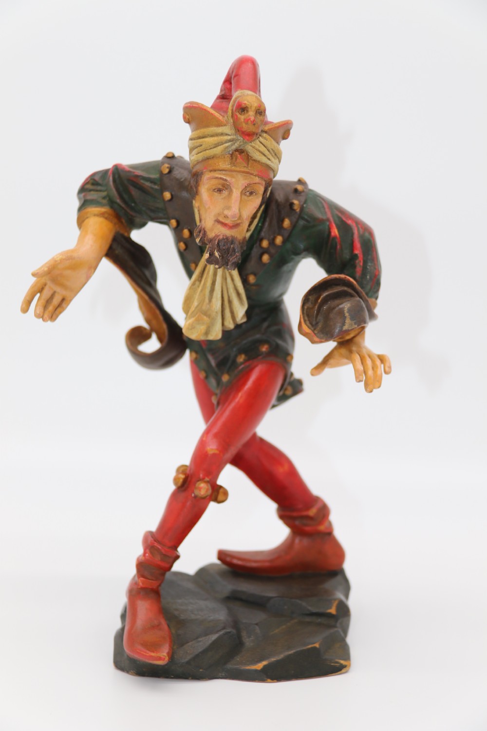 A superb pair of Black Forest carved lime wood and polychrome painted dancing jester figures View II