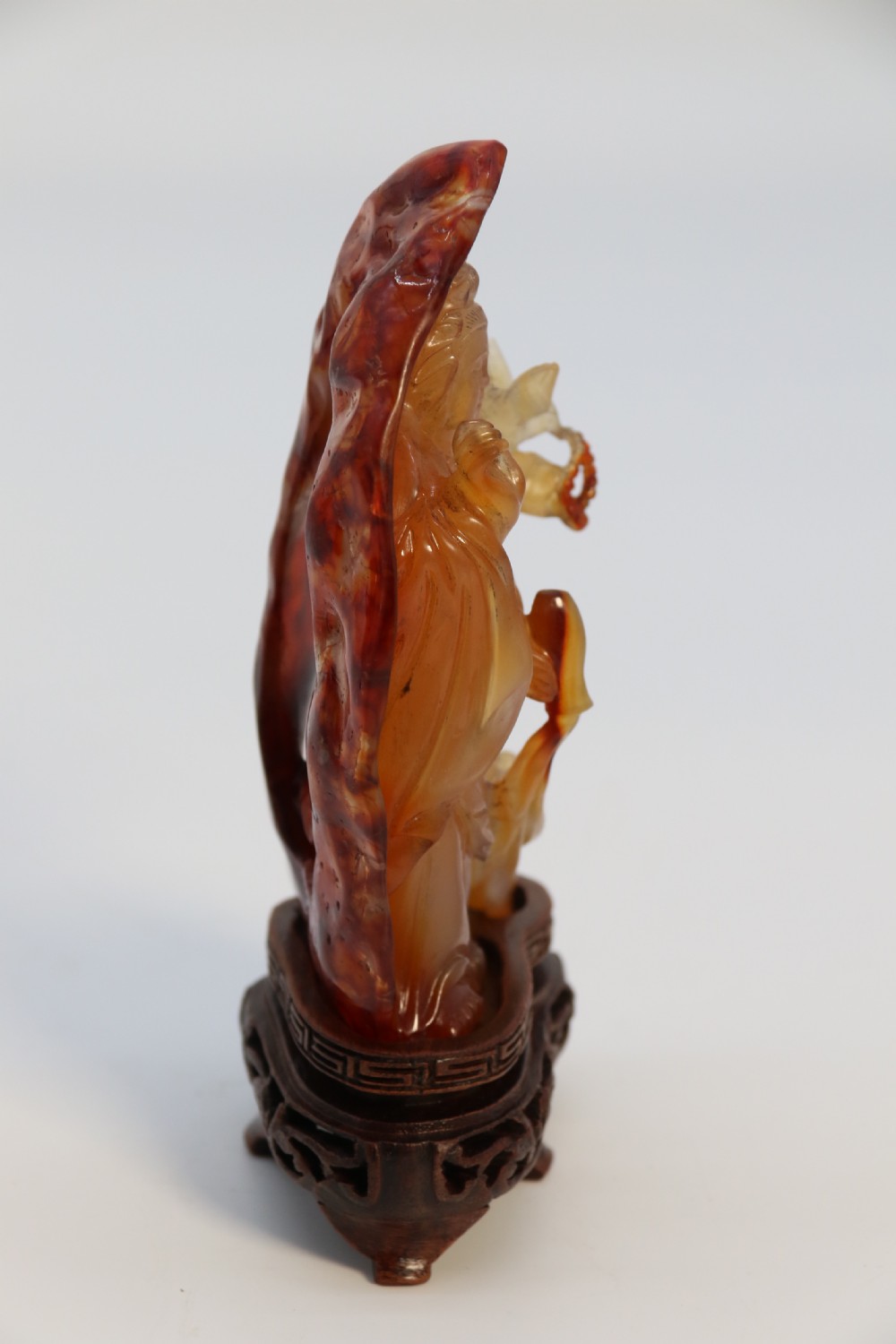 A very fine and rare Chinese hand carved agate hardstone figure of the goddess Guanyin. View III