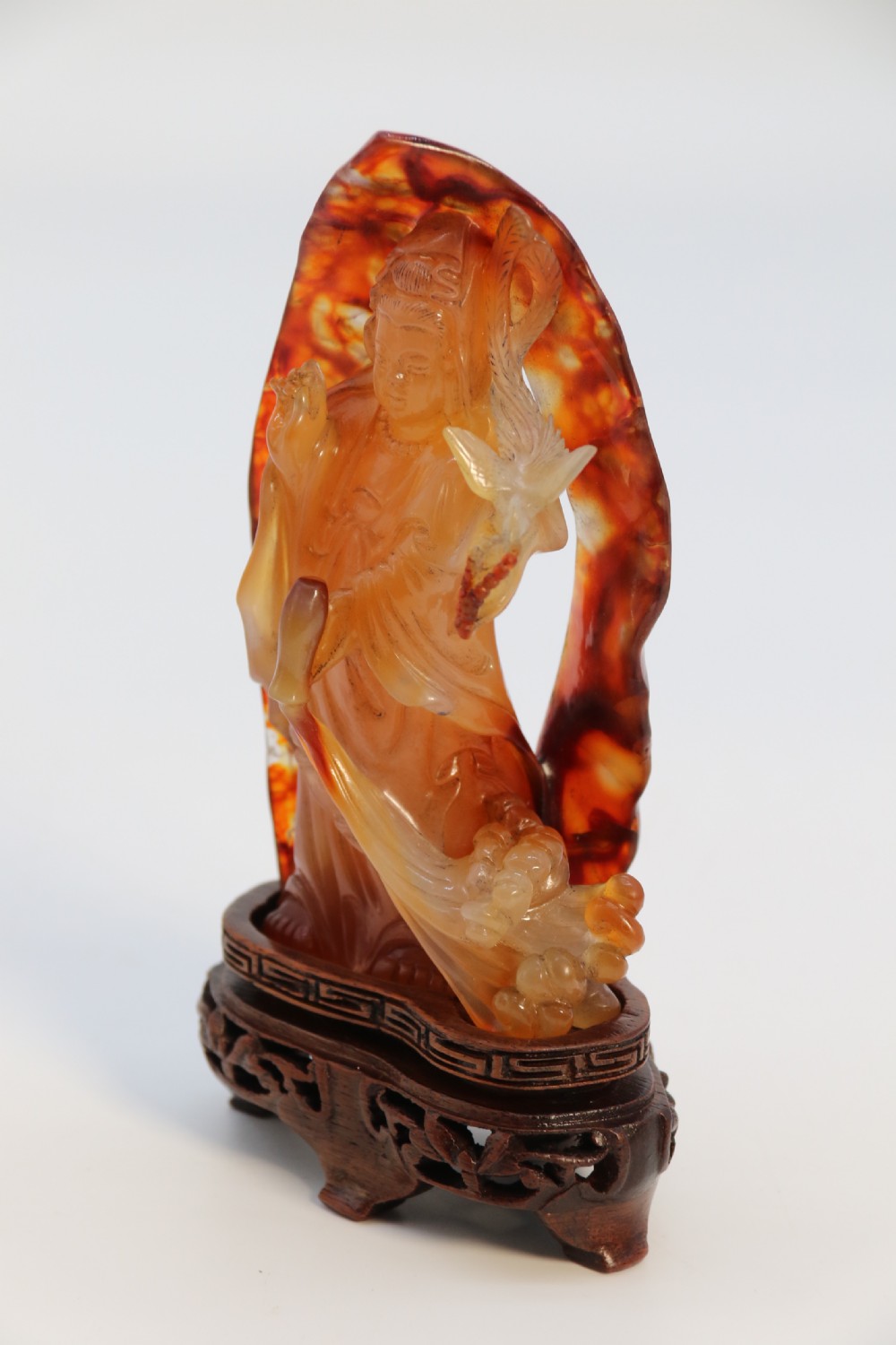 A very fine and rare Chinese hand carved agate hardstone figure of the goddess Guanyin. View IX