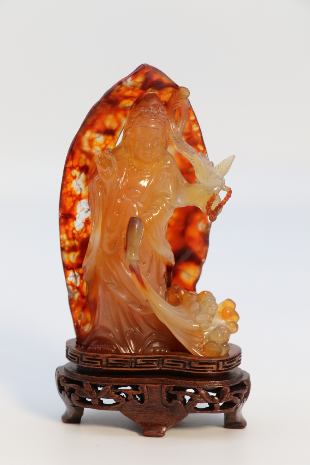 A very fine and rare Chinese hand carved agate hardstone figure of the goddess Guanyin. View X
