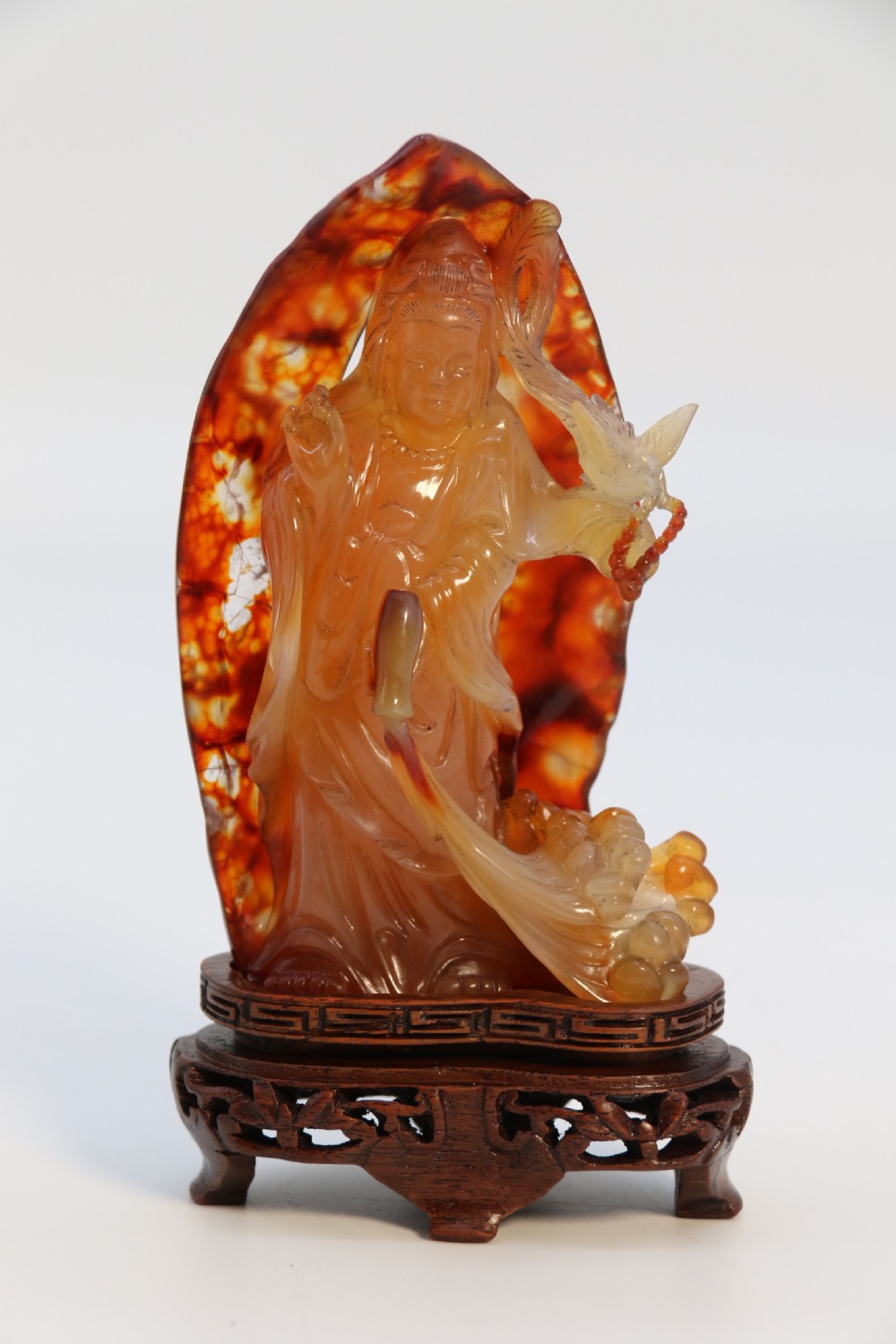 A very fine and rare Chinese hand carved agate hardstone figure of the goddess Guanyin. View XI