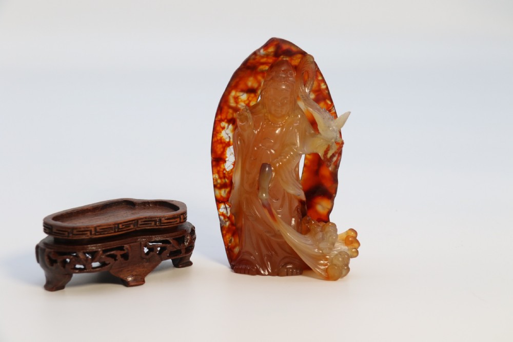 A very fine and rare Chinese hand carved agate hardstone figure of the goddess Guanyin. View XII