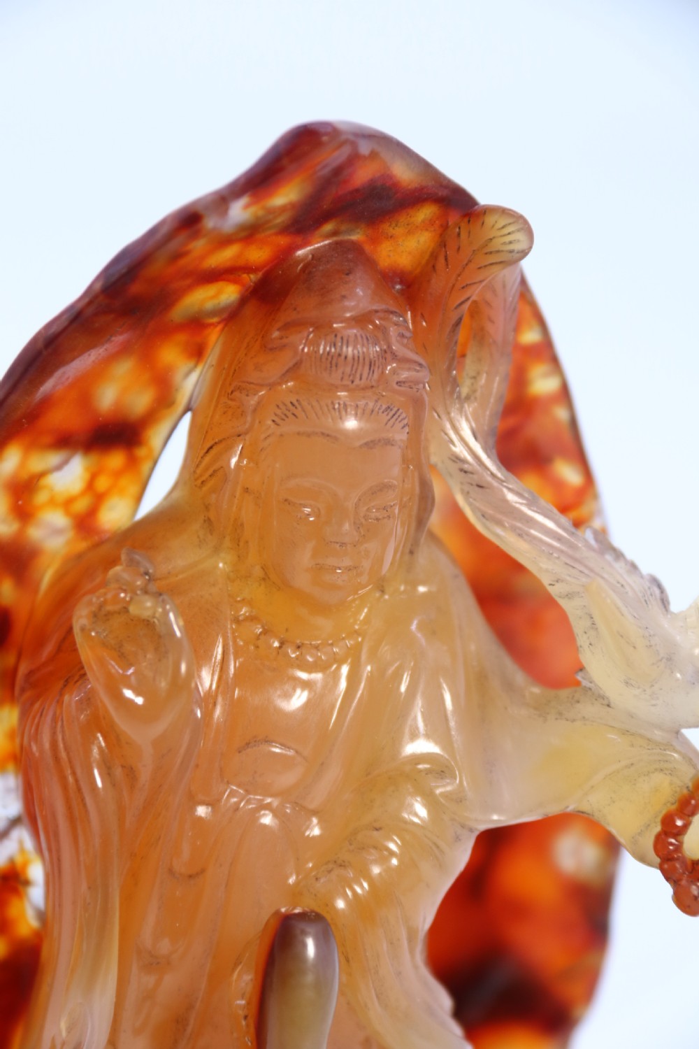 A very fine and rare Chinese hand carved agate hardstone figure of the goddess Guanyin. View XVI