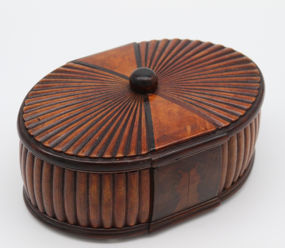 French Art Deco period oval shaped carved  wood jewel casket