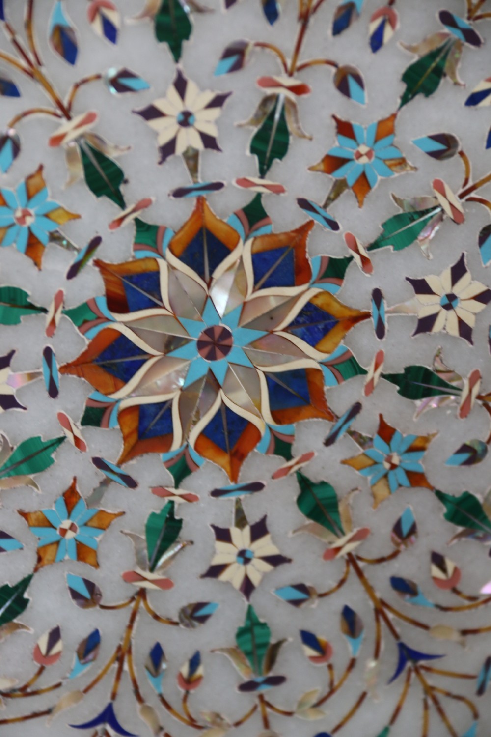 A rare and ultra-fine Raj period Indian white marble charger profusely inlaid with semi-precious cut stones. View IX