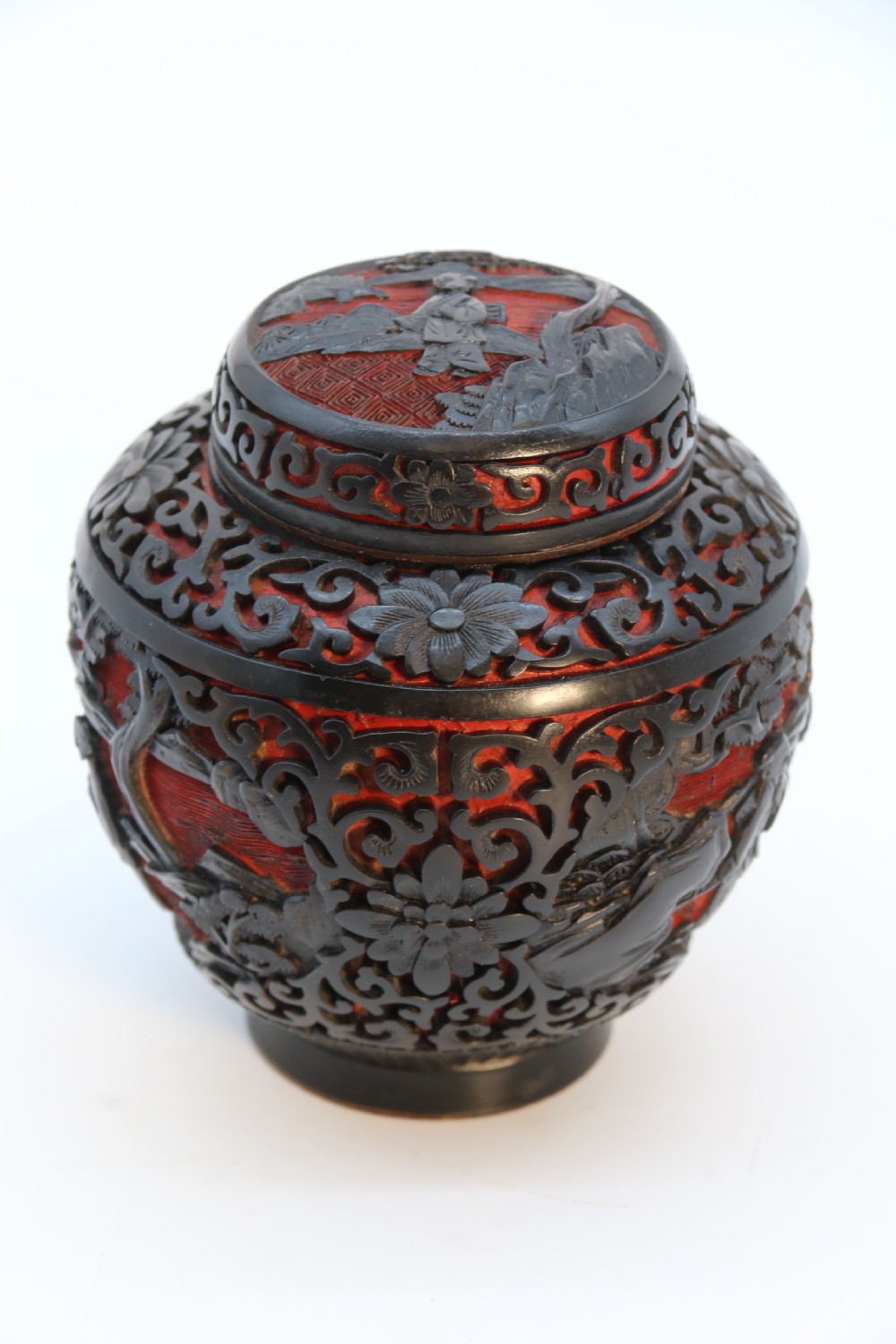 A fine Chinese carved cinnabar red and black lacquer jar and cover, circa 1920 View X