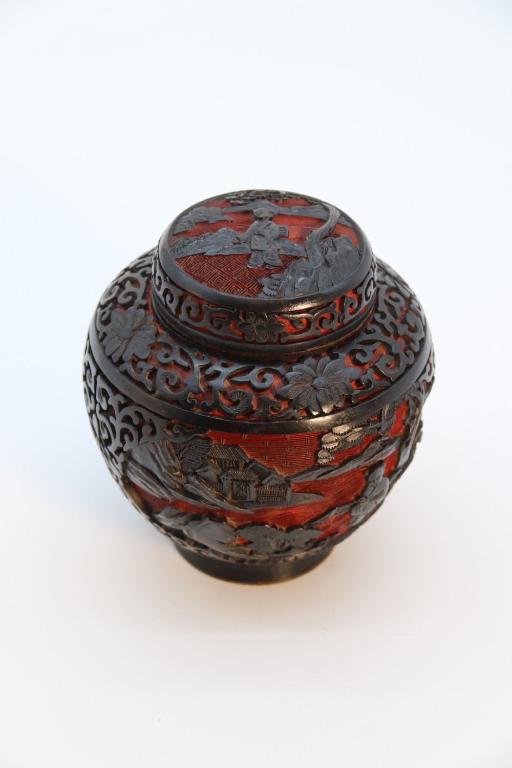 A fine Chinese carved cinnabar red and black lacquer jar and cover, circa 1920 View XXIII