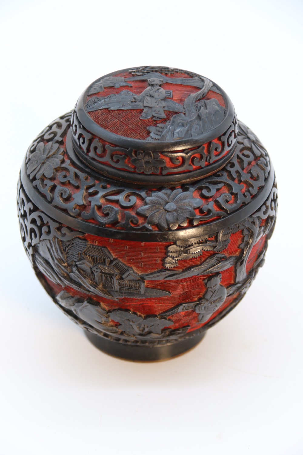 A fine Chinese carved cinnabar red and black lacquer jar and cover, circa 1920 View XXVIII