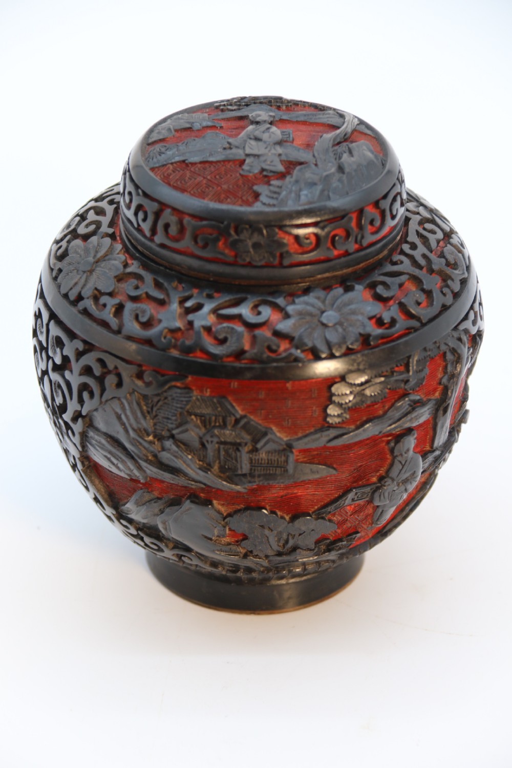 A fine Chinese carved cinnabar red and black lacquer jar and cover, circa 1920 View XXX