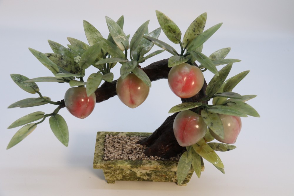 A rare Chinese large hardstone study of a fruiting peach bonsai tree, circa1930

 View II