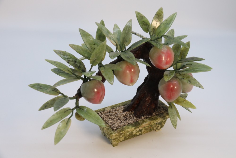 A rare Chinese large hardstone study of a fruiting peach bonsai tree, circa1930

 View III
