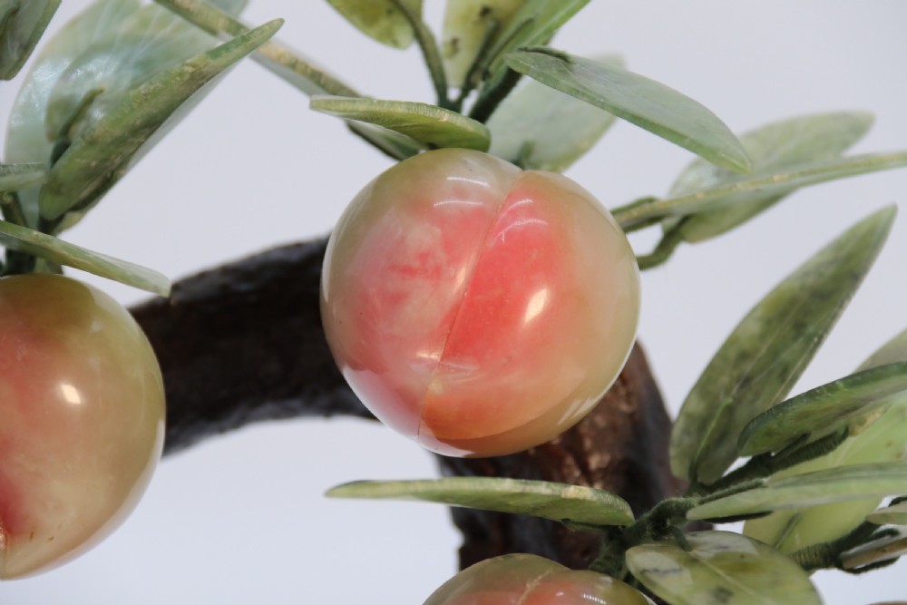 A rare Chinese large hardstone study of a fruiting peach bonsai tree, circa1930

 View XIII