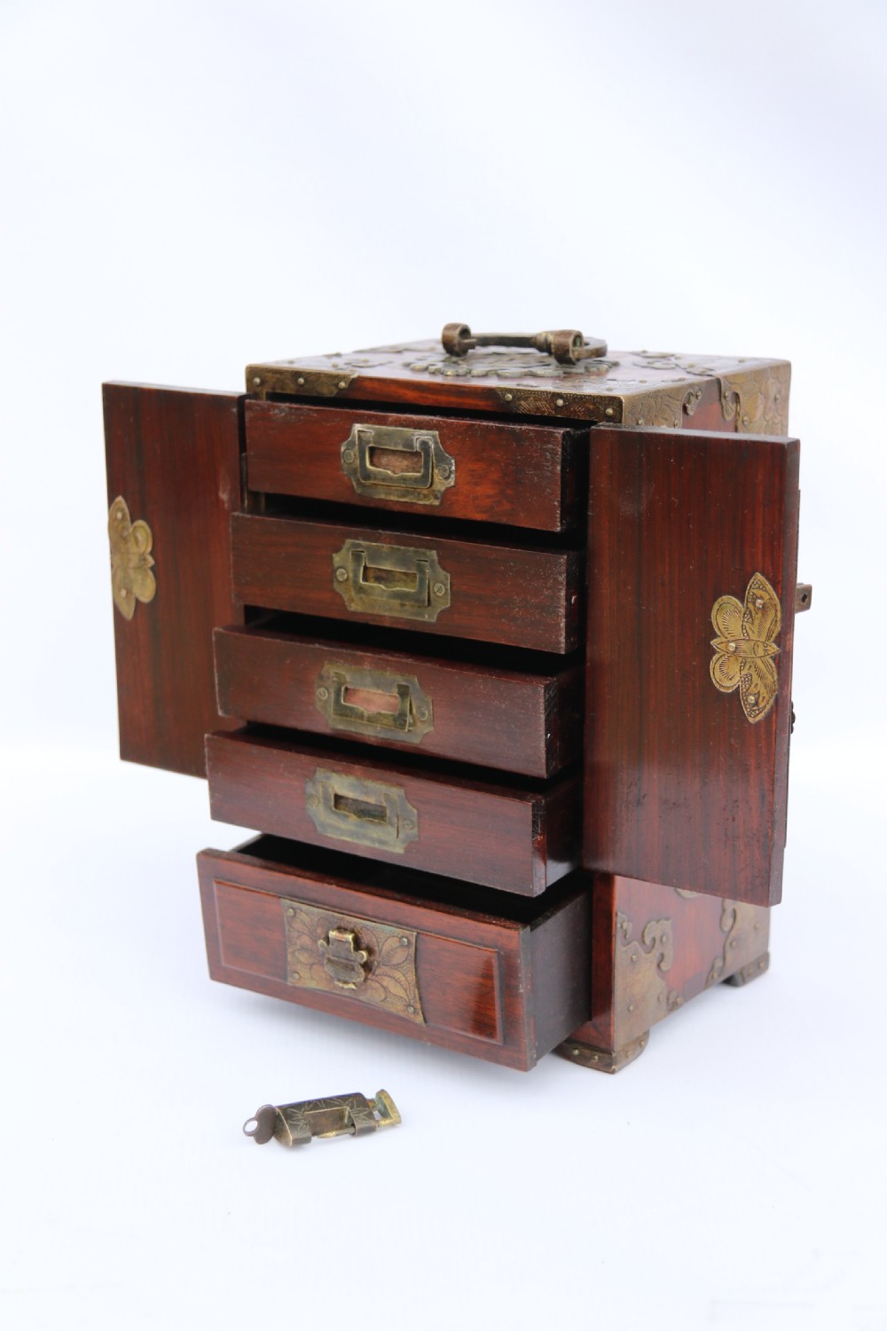 A rare Chinese hardwood and engraved bronze mounted small cabinet with a makers stamp. View XV