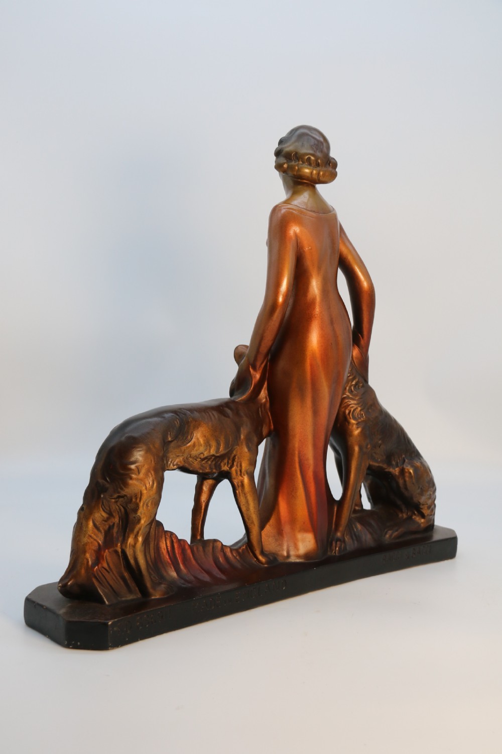 An elegant art deco plaster and cold painted figure group, circa 1930 View X