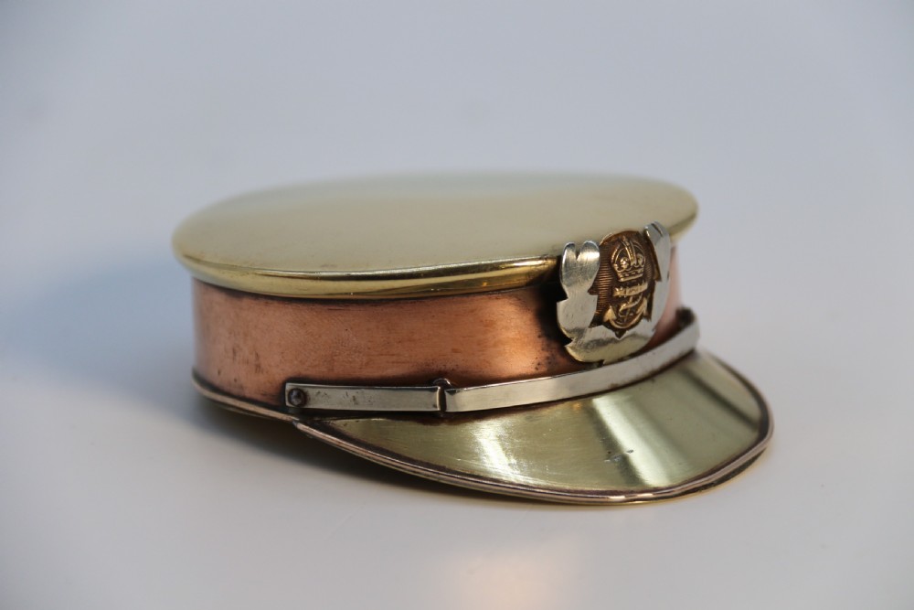 A rare novelty pocket snuff box in the form of an English naval officers peaked cap. View III