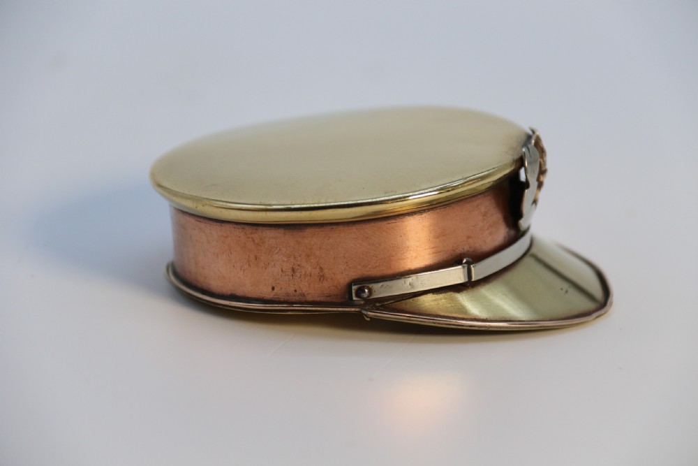 A rare novelty pocket snuff box in the form of an English naval officers peaked cap. View IV