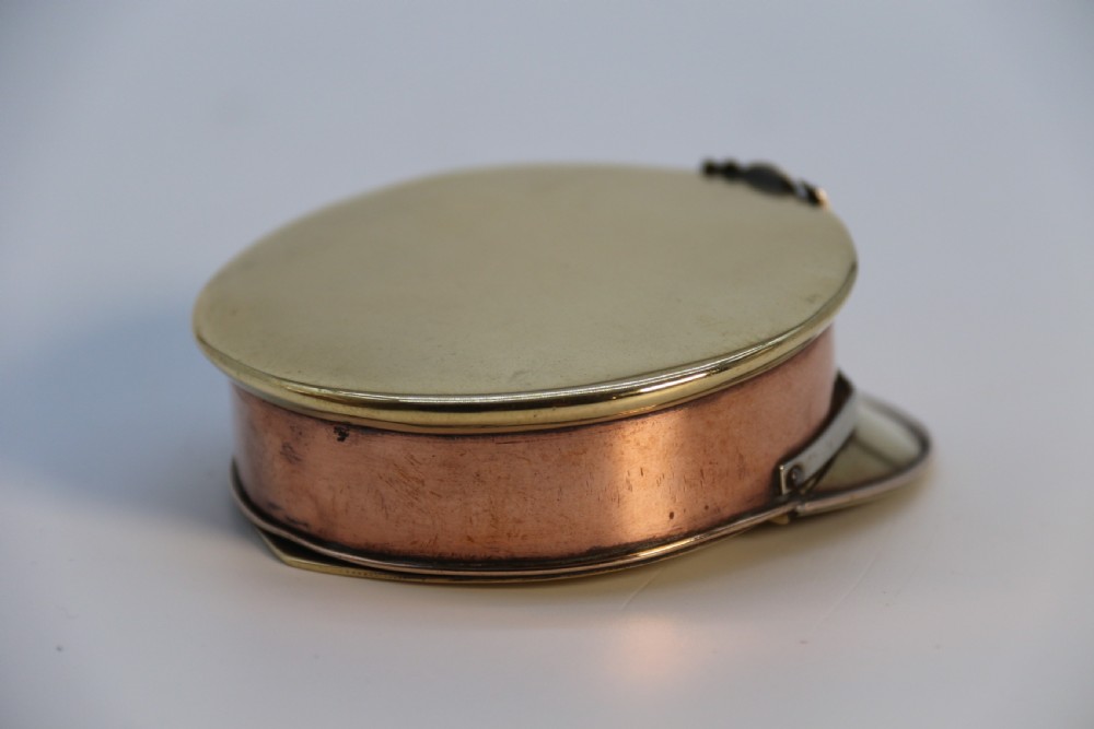 A rare novelty pocket snuff box in the form of an English naval officers peaked cap. View V