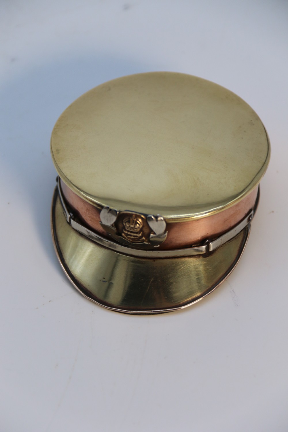 A rare novelty pocket snuff box in the form of an English naval officers peaked cap. View VIII