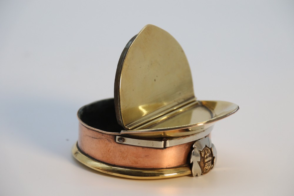A rare novelty pocket snuff box in the form of an English naval officers peaked cap. View X