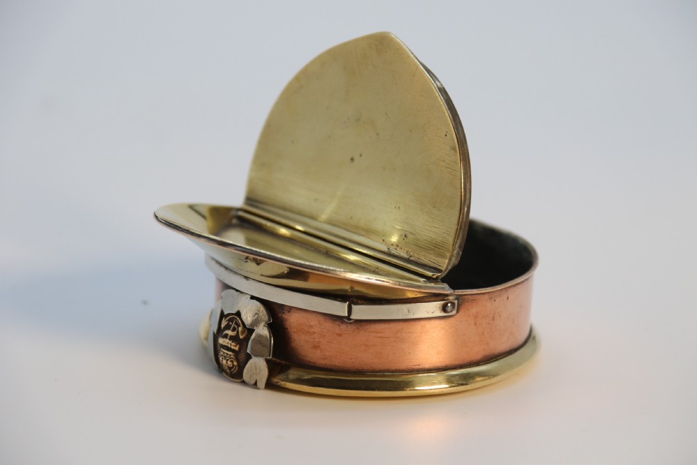 A rare novelty pocket snuff box in the form of an English naval officers peaked cap. View XI