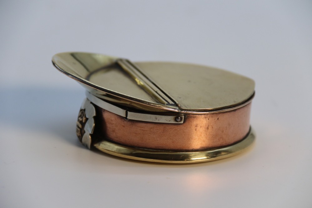 A rare novelty pocket snuff box in the form of an English naval officers peaked cap. View XIII