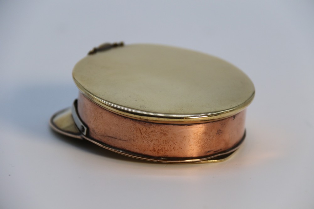 A rare novelty pocket snuff box in the form of an English naval officers peaked cap. View XVI