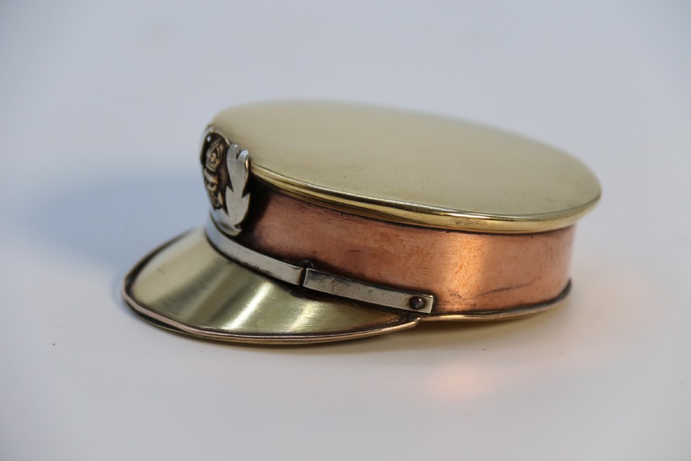 A rare novelty pocket snuff box in the form of an English naval officers peaked cap. View XVIII