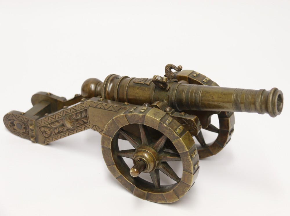 A 19th century French bronze model cannon.