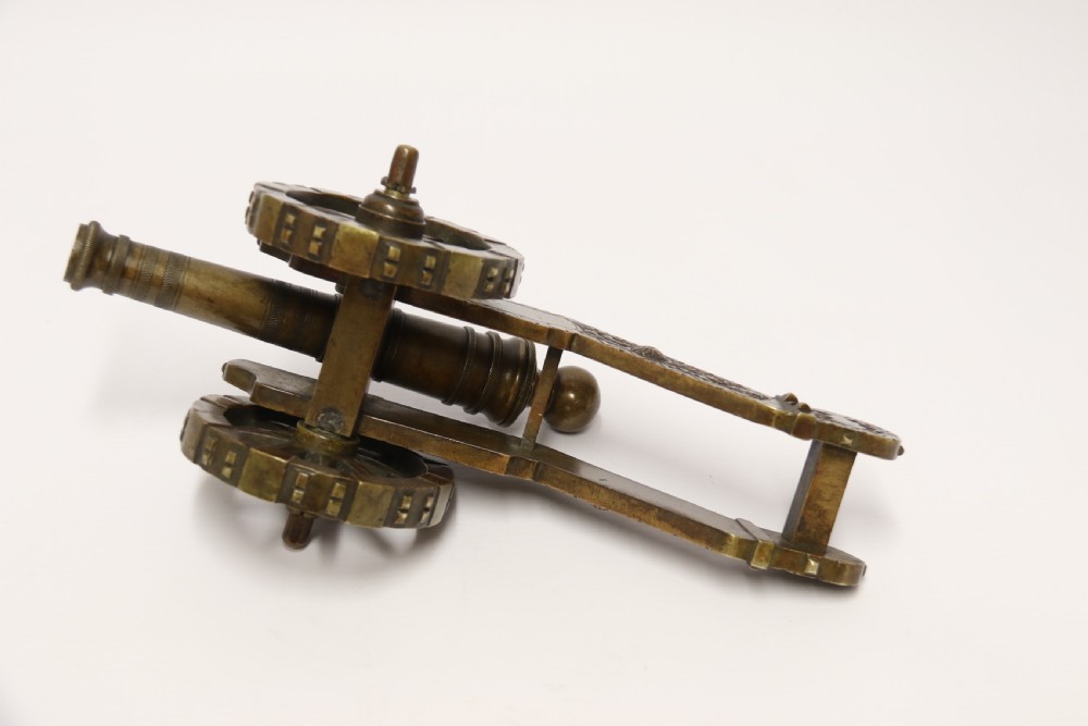 A 19th century French bronze model cannon. View XIX