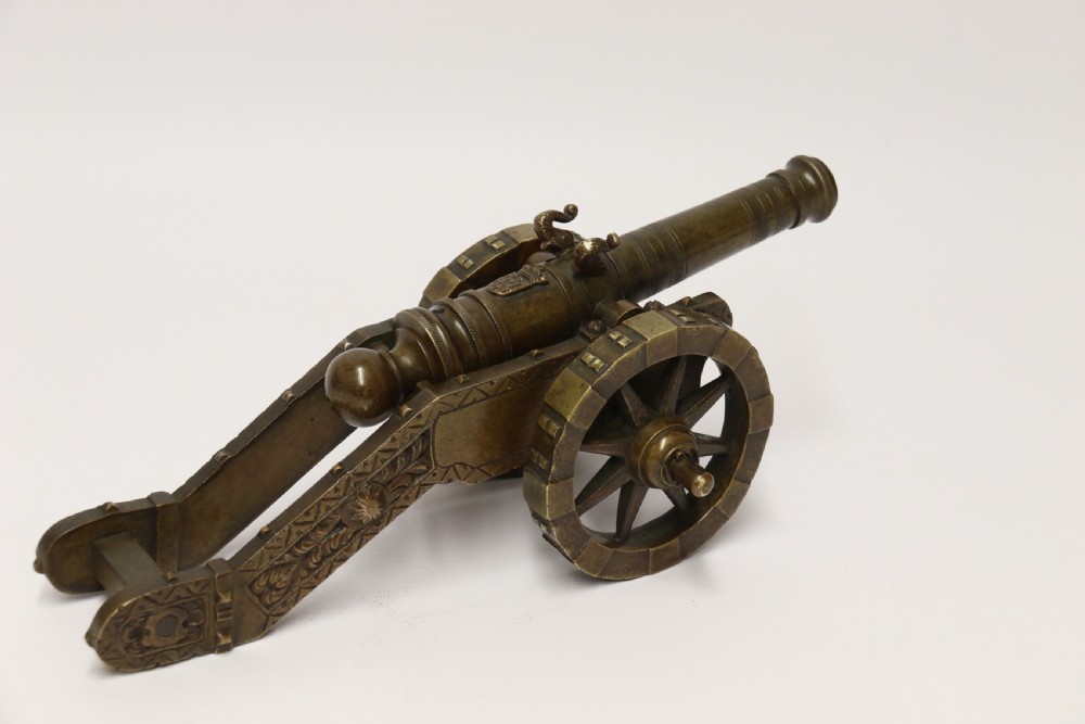 A 19th century French bronze model cannon. View XXVI