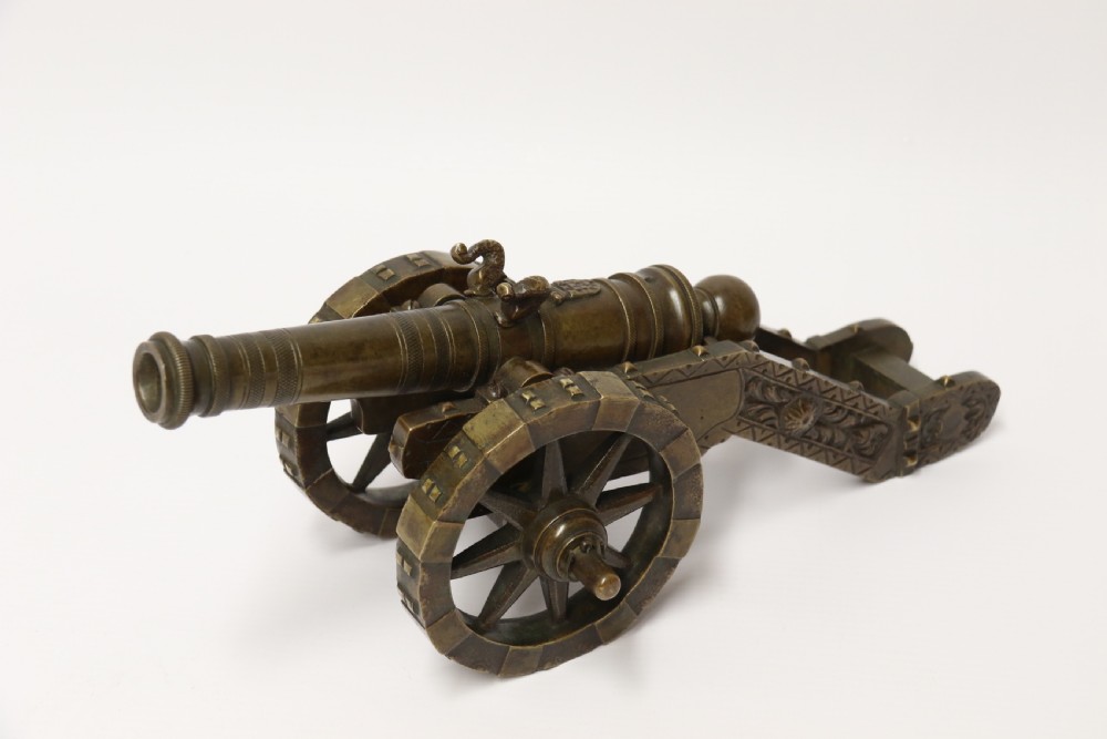 A 19th century French bronze model cannon. View XXVII