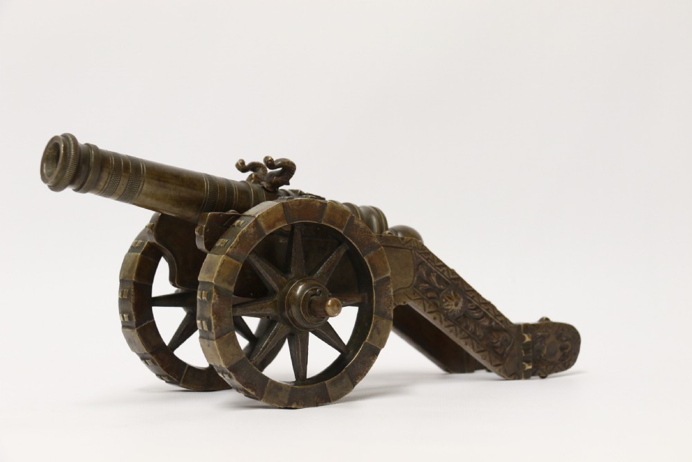 A 19th century French bronze model cannon. View XXVIII