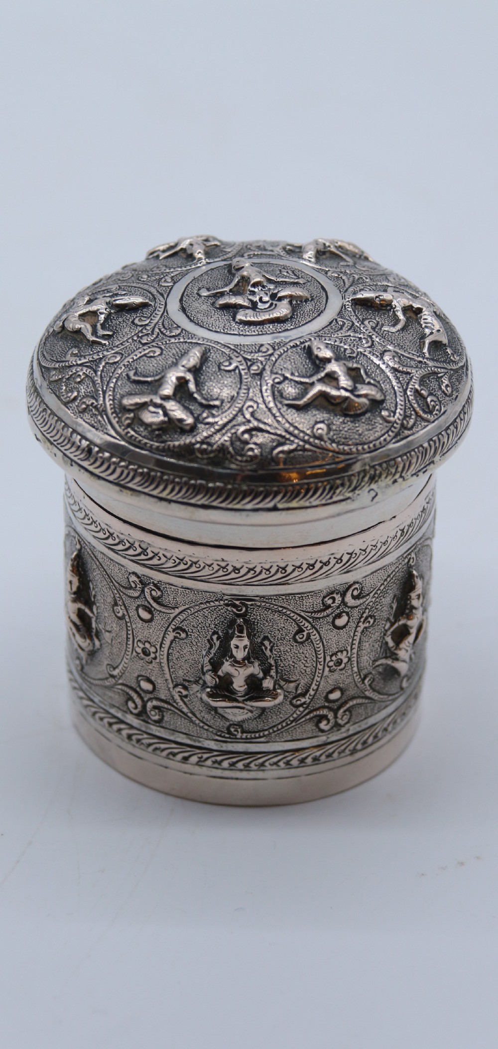 A fine Indian Raj period silver repousse decorated lidded container, c 1900