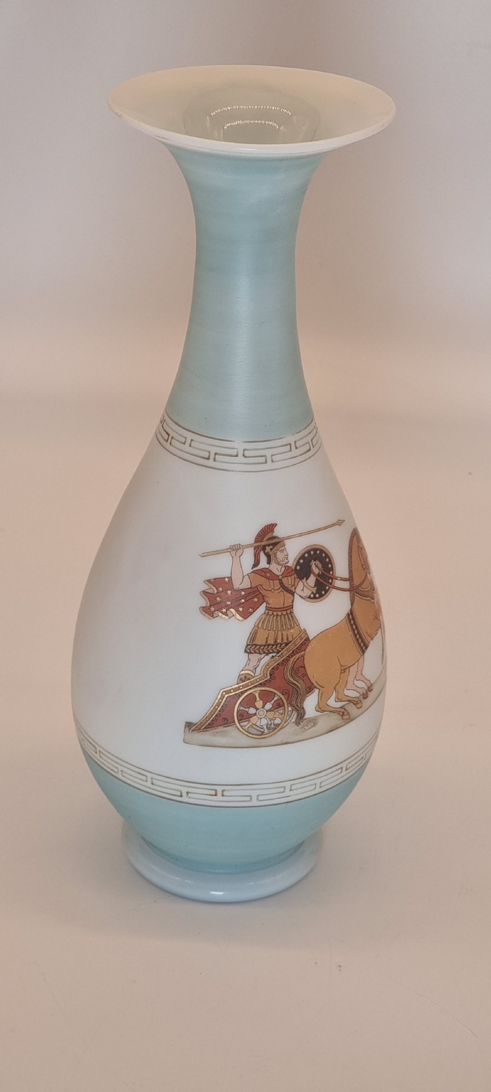 A late nineteenth-century opaque white and light blue glass vase decorated with a hand-painted scene of a Greek chariot and warrior bordered by Greek key patterns. View III