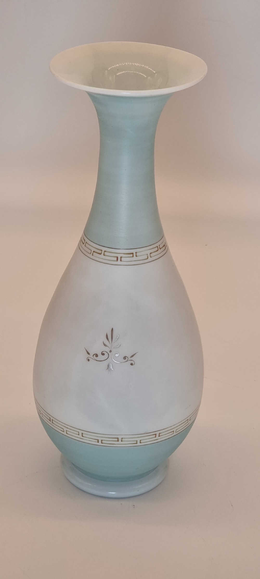 A late nineteenth-century opaque white and light blue glass vase decorated with a hand-painted scene of a Greek chariot and warrior bordered by Greek key patterns. View V