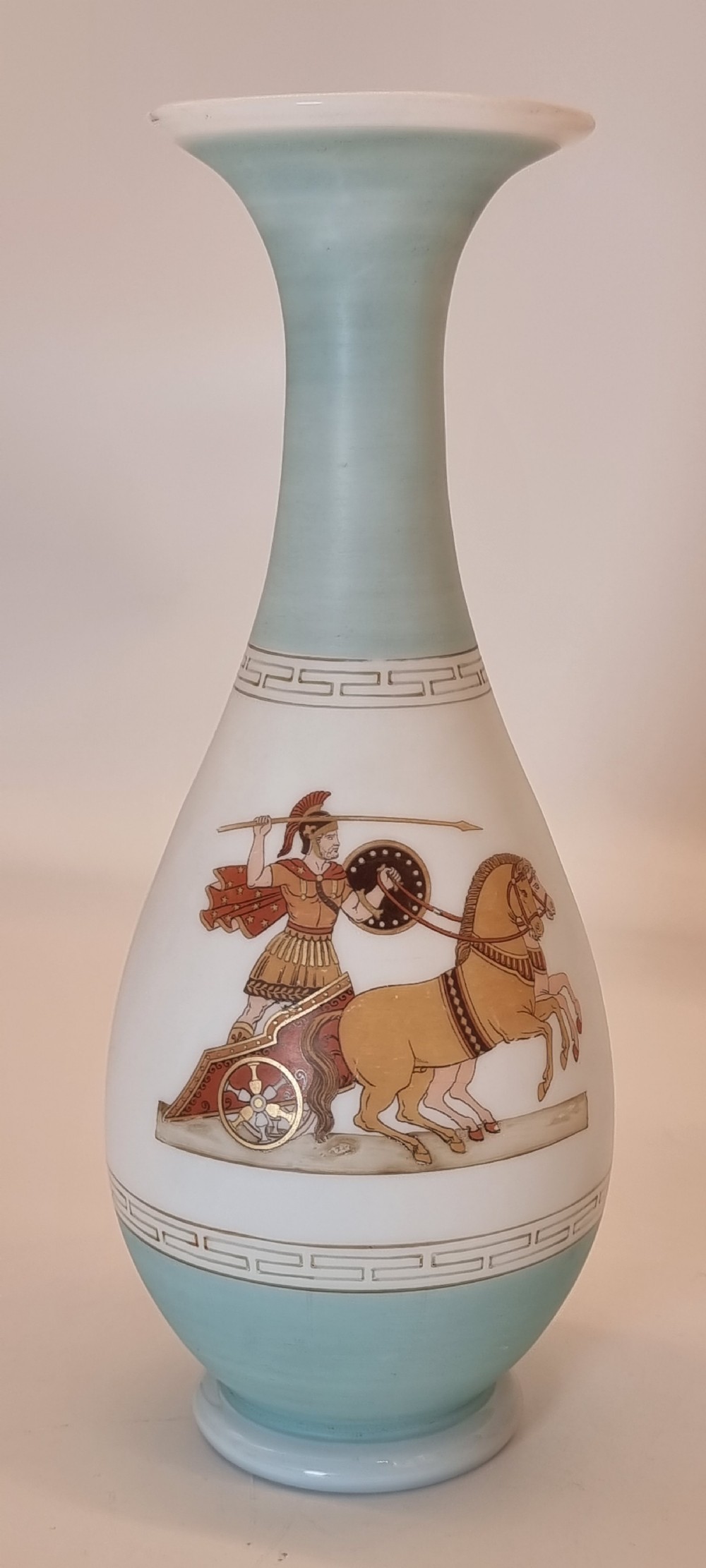 A late nineteenth-century opaque white and light blue glass vase decorated with a hand-painted scene of a Greek chariot and warrior bordered by Greek key patterns. View VII