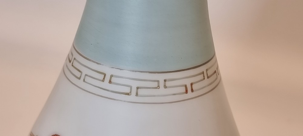 A late nineteenth-century opaque white and light blue glass vase decorated with a hand-painted scene of a Greek chariot and warrior bordered by Greek key patterns. View XIII