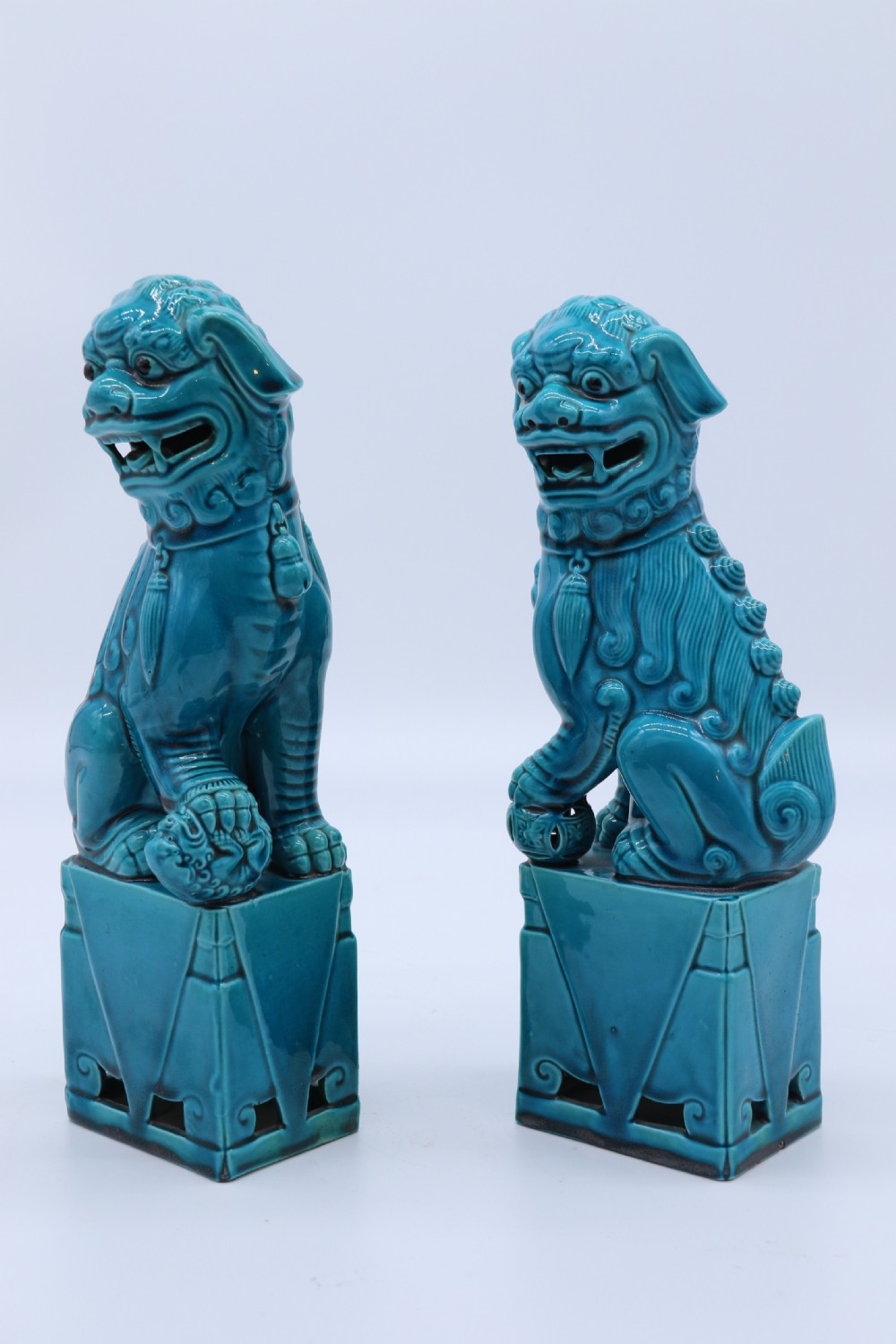 A pair of porcelain Chinese Buddhist Temple lions or foo dogs, circa 1900 View II