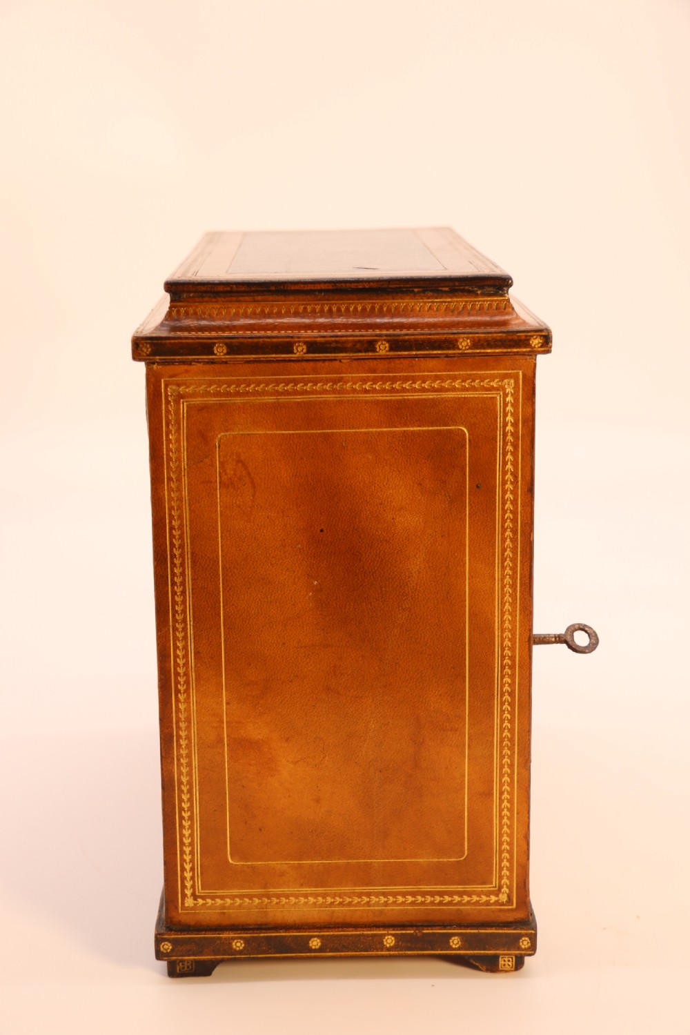 An Italian Grand Tour late 19th century jewellery cabinet finished in gilt tooled leather with a hand coloured view of The Royal Palace, Caserta Italy.

 View III