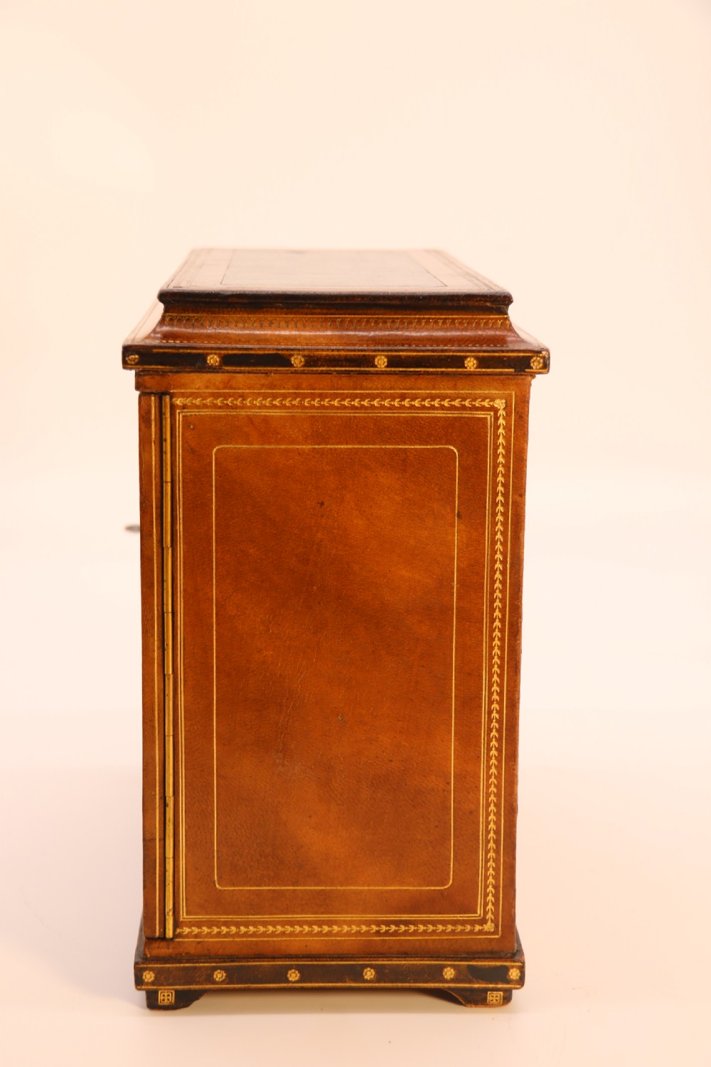 An Italian Grand Tour late 19th century jewellery cabinet finished in gilt tooled leather with a hand coloured view of The Royal Palace, Caserta Italy.

 View VII