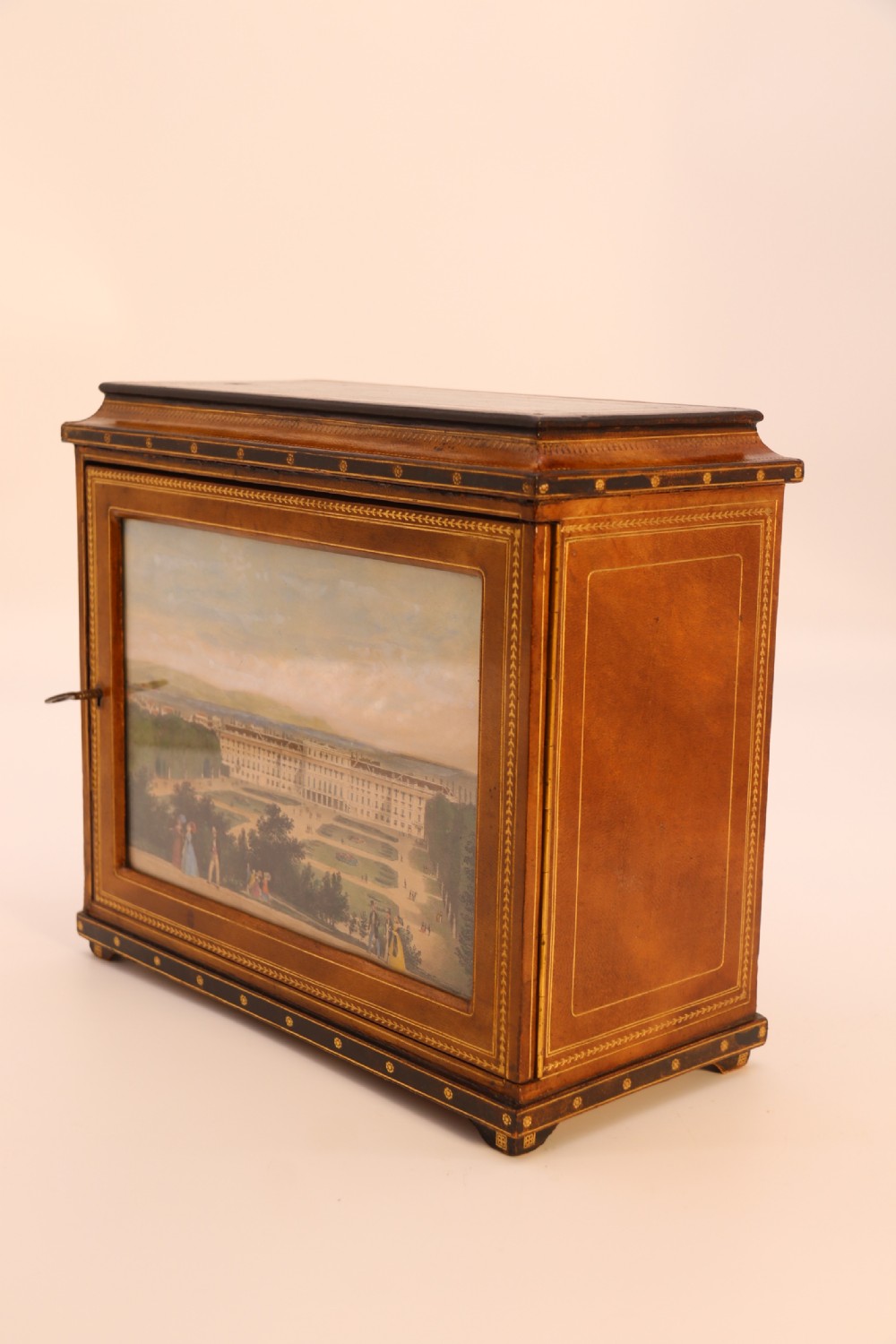 An Italian Grand Tour late 19th century jewellery cabinet finished in gilt tooled leather with a hand coloured view of The Royal Palace, Caserta Italy.

 View VIII