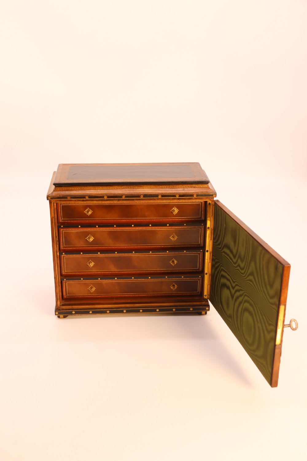 An Italian Grand Tour late 19th century jewellery cabinet finished in gilt tooled leather with a hand coloured view of The Royal Palace, Caserta Italy.

 View IX