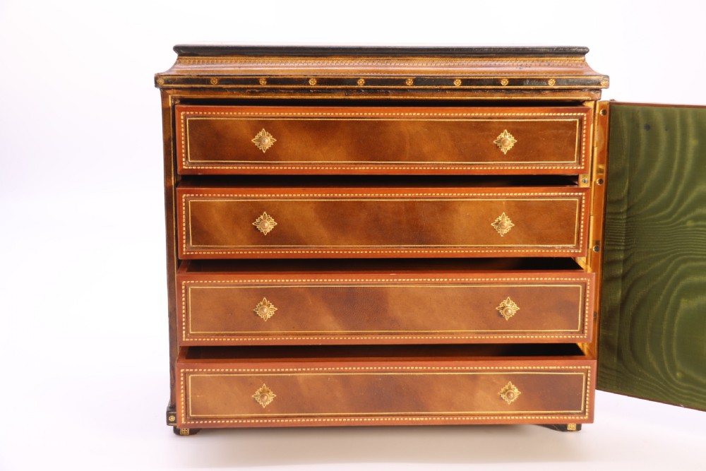 An Italian Grand Tour late 19th century jewellery cabinet finished in gilt tooled leather with a hand coloured view of The Royal Palace, Caserta Italy.

 View XI