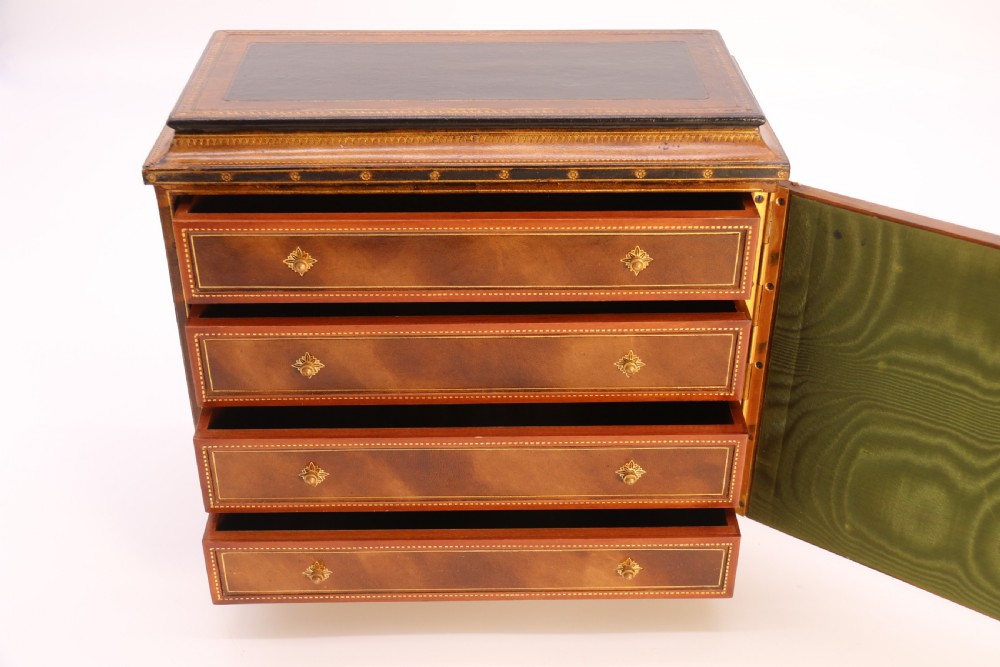 An Italian Grand Tour late 19th century jewellery cabinet finished in gilt tooled leather with a hand coloured view of The Royal Palace, Caserta Italy.

 View XII