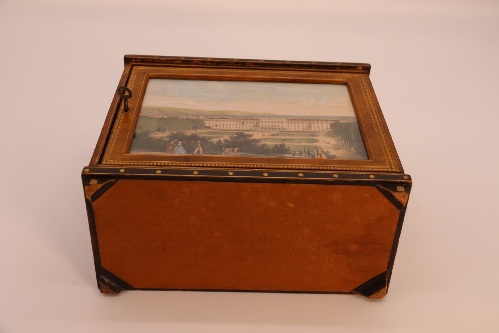 An Italian Grand Tour late 19th century jewellery cabinet finished in gilt tooled leather with a hand coloured view of The Royal Palace, Caserta Italy.

 View XIX