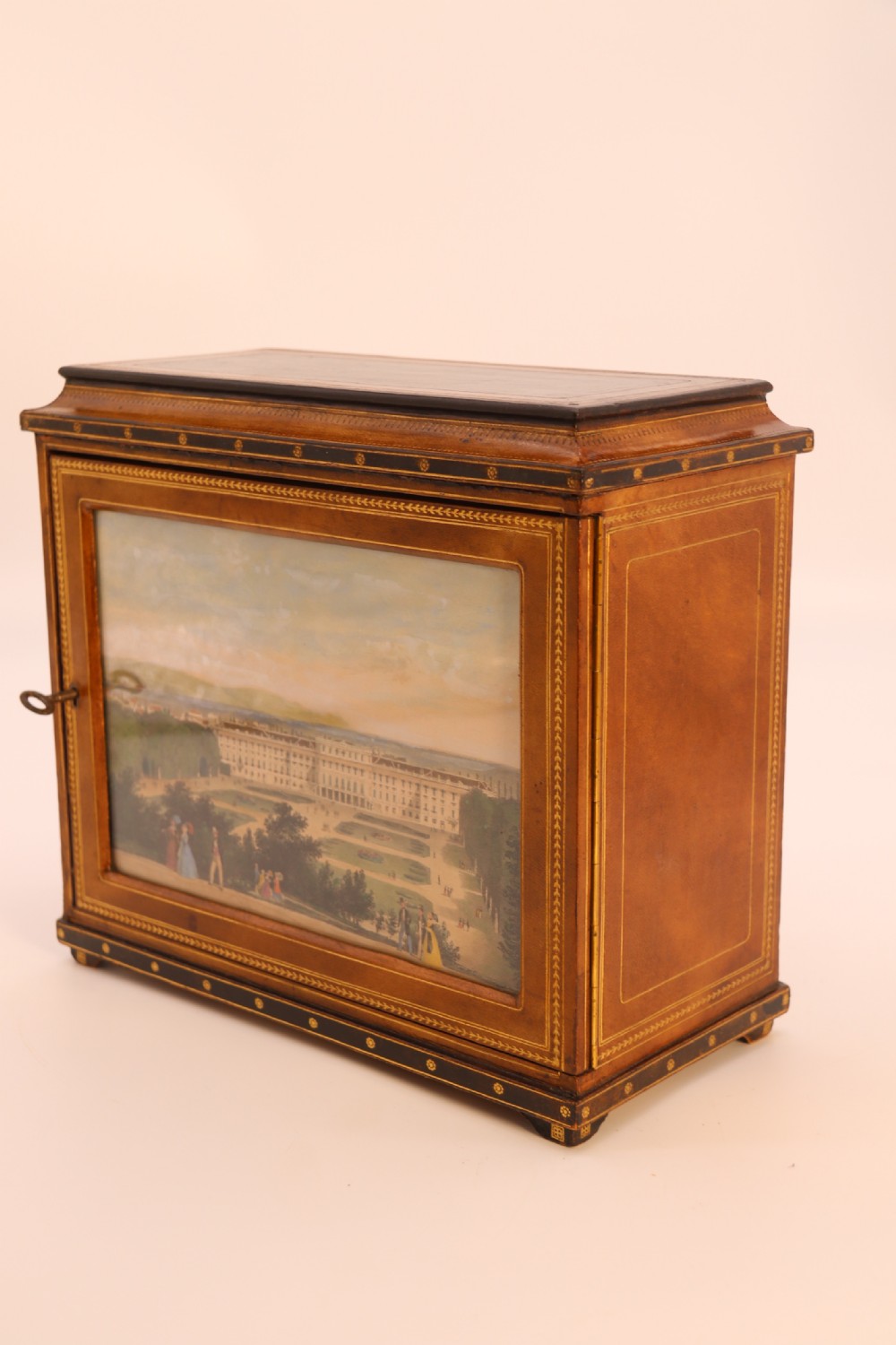 An Italian Grand Tour late 19th century jewellery cabinet finished in gilt tooled leather with a hand coloured view of The Royal Palace, Caserta Italy.

 View XXI