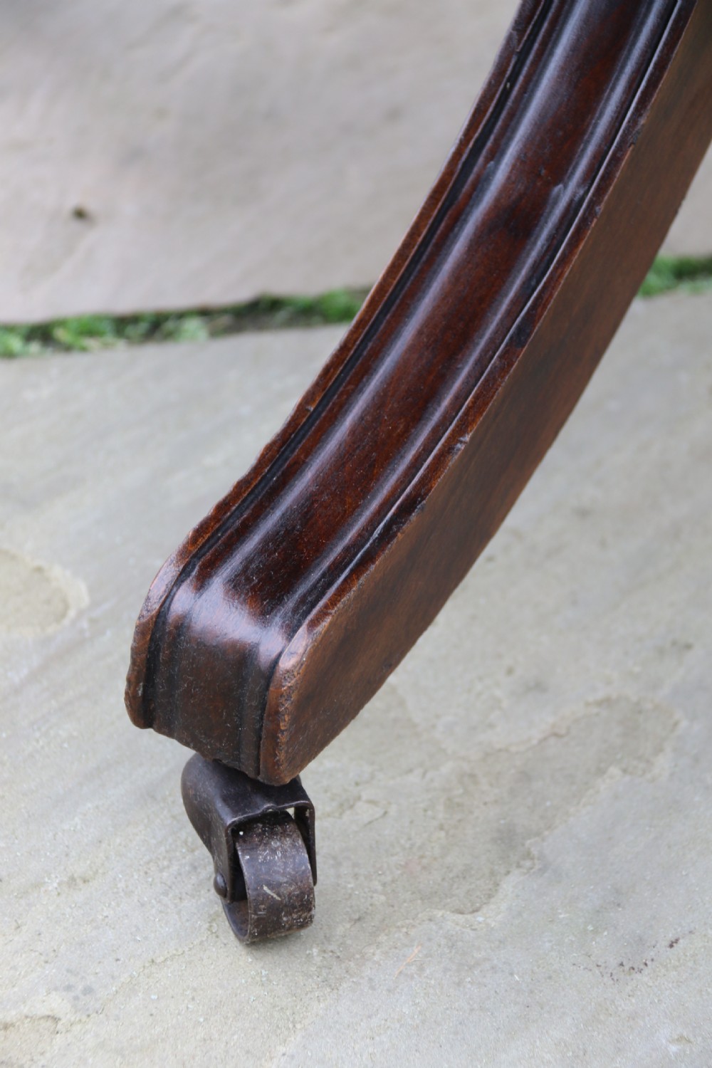 An English tilt and rotate desk/study armchair upholstered in original deep buttoned leather. View XXIX